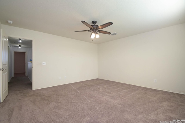 carpeted empty room with ceiling fan