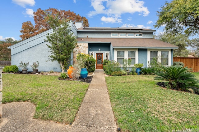 view of front of house with a front lawn