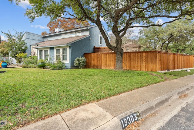 view of property exterior with a lawn