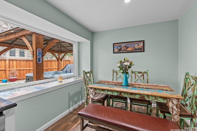 dining space featuring dark hardwood / wood-style floors