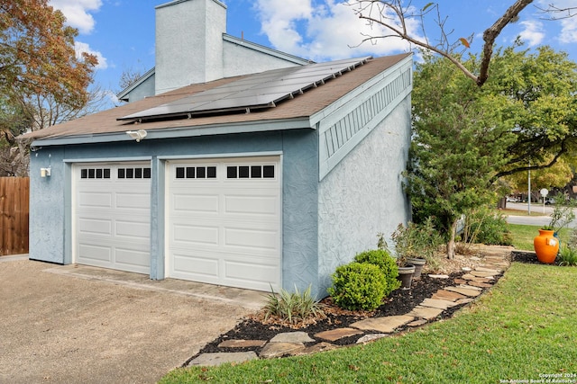 garage featuring solar panels