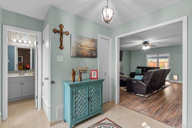 hallway featuring light tile patterned flooring