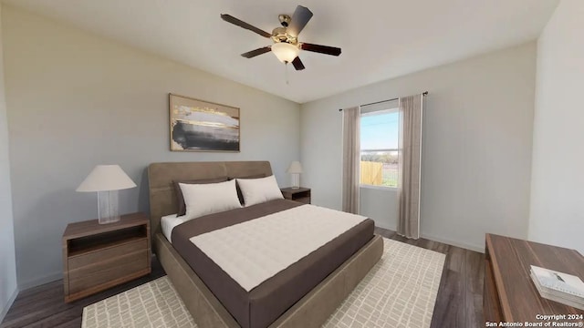 bedroom featuring ceiling fan and dark hardwood / wood-style floors