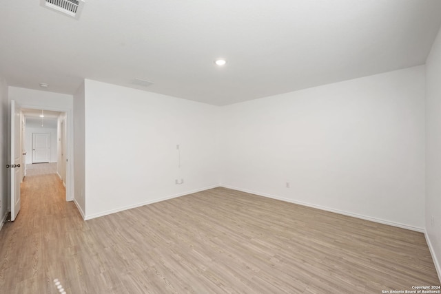 unfurnished room with light wood-type flooring