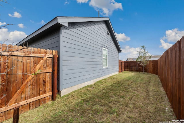 view of property exterior with a yard