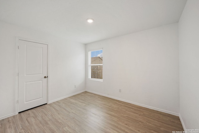 spare room featuring light wood-type flooring