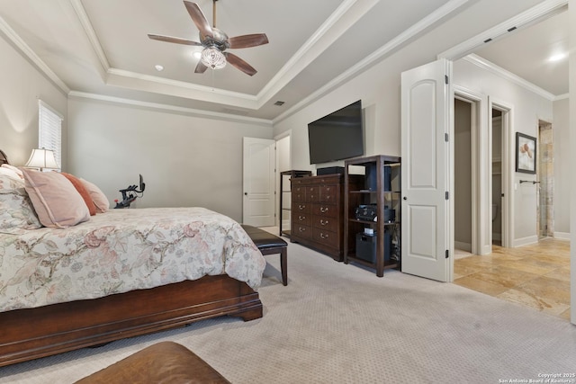 bedroom featuring ceiling fan, a raised ceiling, light colored carpet, and crown molding