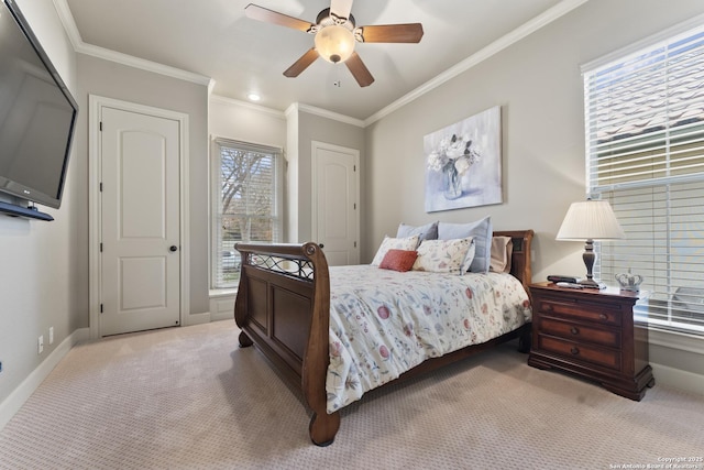 bedroom with multiple windows, light colored carpet, ceiling fan, and ornamental molding