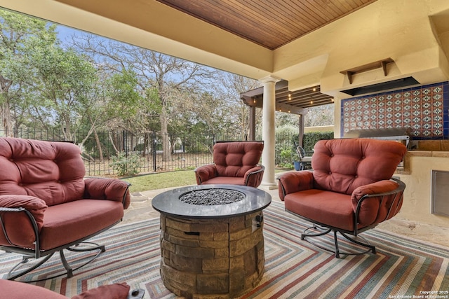 sunroom / solarium with ornate columns and wooden ceiling