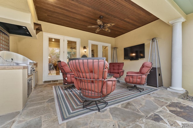 view of patio with ceiling fan, a grill, exterior kitchen, and french doors