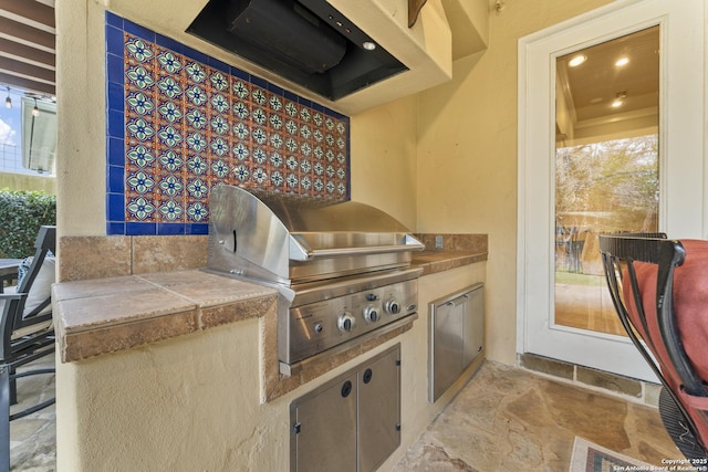 view of patio with a grill and exterior kitchen