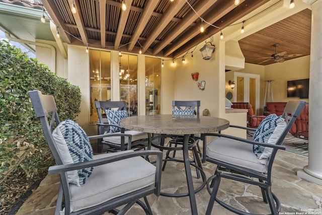 view of patio featuring ceiling fan