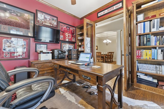 office with ceiling fan with notable chandelier, decorative columns, and crown molding