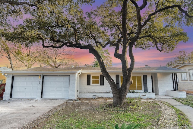 single story home with a garage