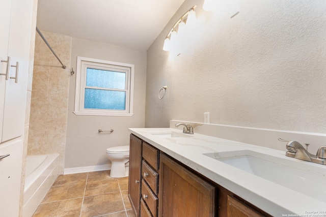 bathroom featuring tile patterned flooring, vanity, and toilet