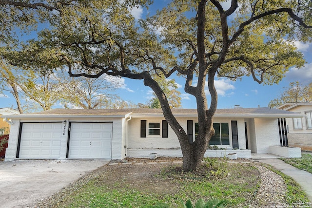 ranch-style home with a garage