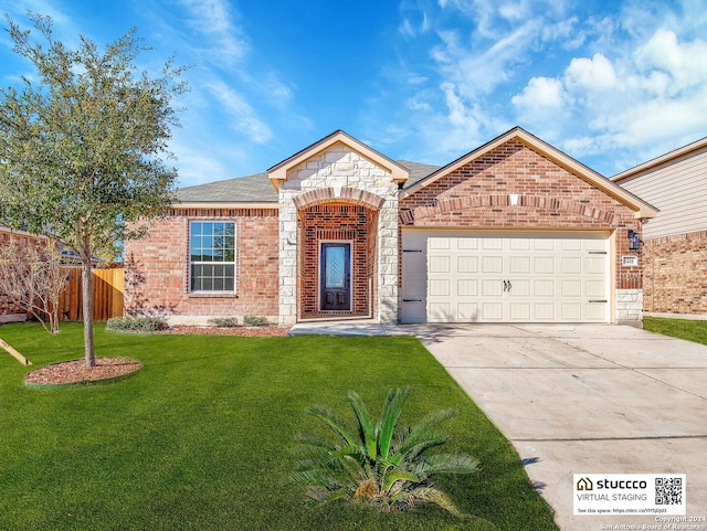 view of front of home featuring a garage and a front lawn