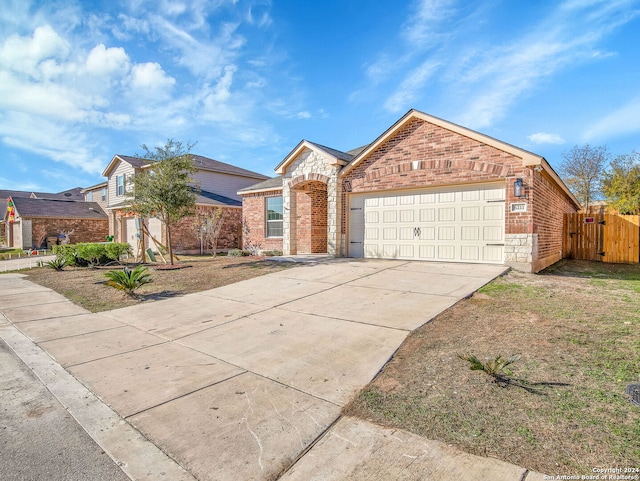 single story home featuring a garage