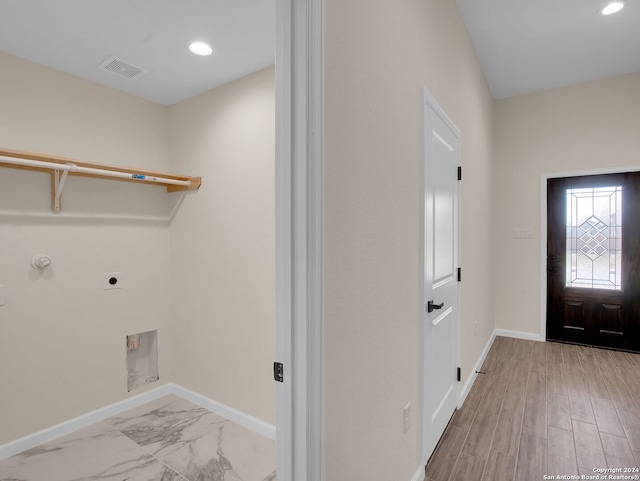 laundry room featuring light hardwood / wood-style flooring and hookup for an electric dryer