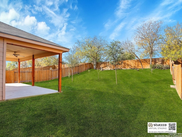 view of yard featuring a patio and ceiling fan