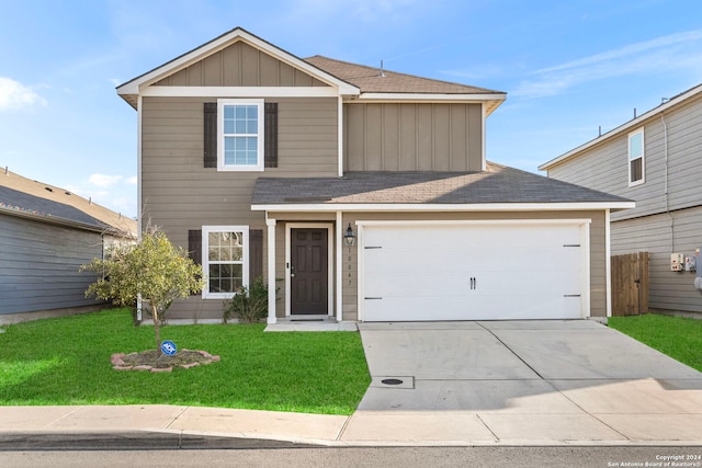 view of front facade with a garage and a front yard