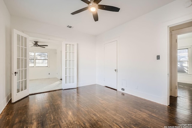 unfurnished room with french doors, dark hardwood / wood-style floors, and ceiling fan