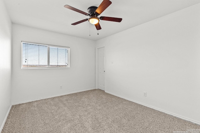 empty room featuring ceiling fan and carpet flooring