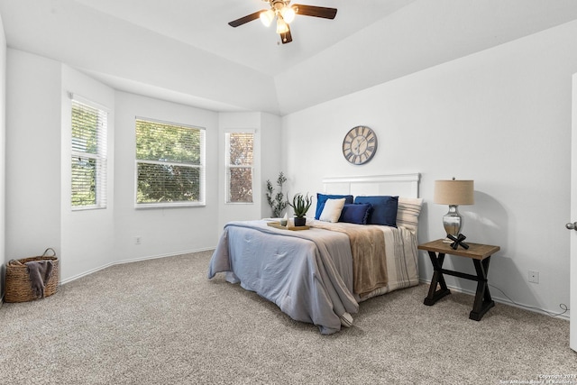 carpeted bedroom featuring vaulted ceiling and ceiling fan