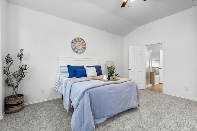 bedroom featuring ceiling fan, connected bathroom, vaulted ceiling, and carpet flooring