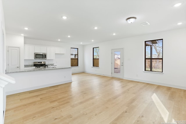 kitchen with white cabinets, recessed lighting, visible vents, and appliances with stainless steel finishes