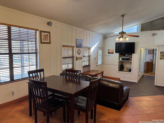 tiled dining room featuring ceiling fan and lofted ceiling