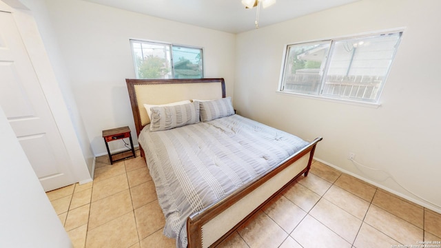 bedroom featuring light tile patterned floors