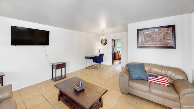 tiled living room featuring a notable chandelier