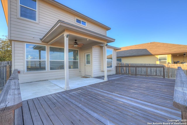 wooden deck featuring a patio, fence, and a ceiling fan