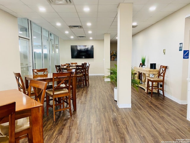 dining space featuring dark hardwood / wood-style flooring