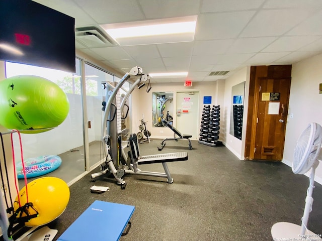 workout area with a drop ceiling