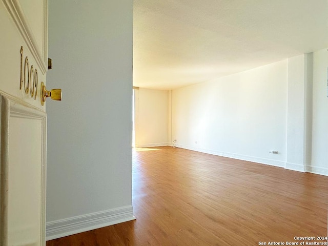 unfurnished room featuring wood-type flooring