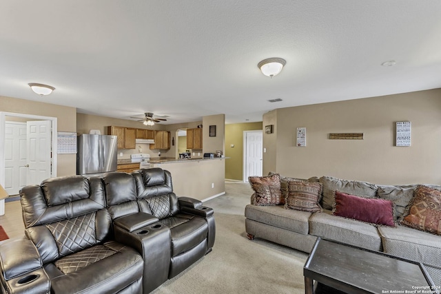 living room with ceiling fan and light colored carpet