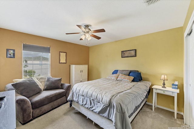 carpeted bedroom with ceiling fan