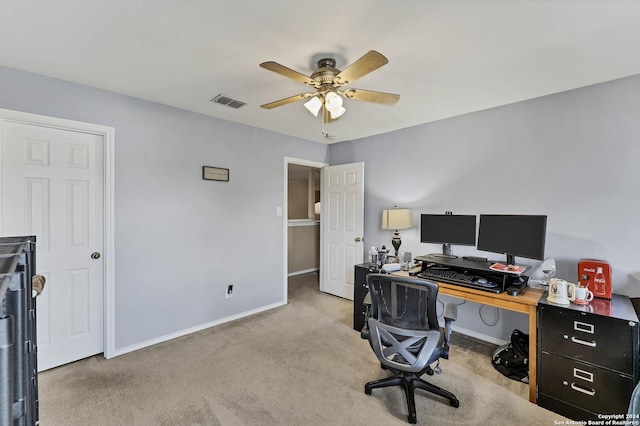 office area with ceiling fan and light colored carpet