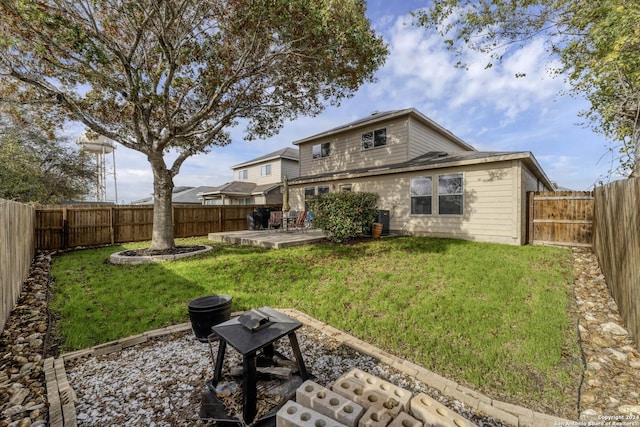 back of house with a lawn, cooling unit, and a patio area