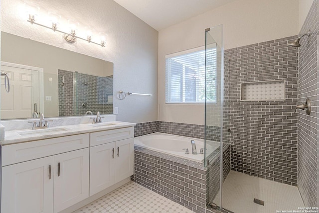 bathroom featuring separate shower and tub, tile patterned floors, and vanity