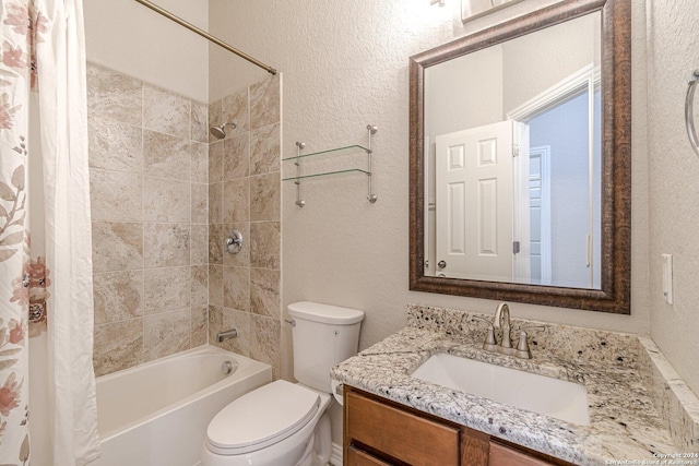 full bathroom with vanity, toilet, and shower / bath combo with shower curtain