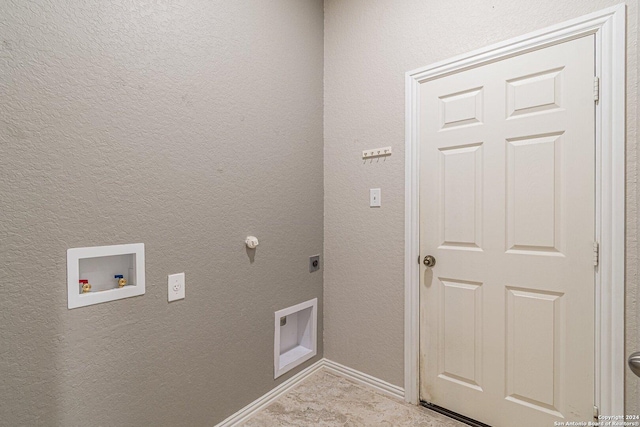 washroom with hookup for an electric dryer and hookup for a washing machine