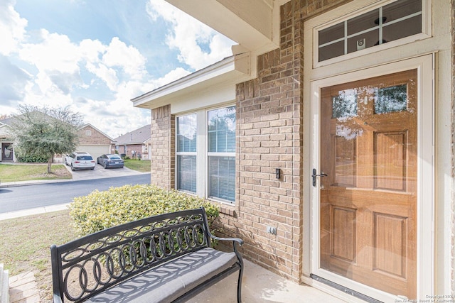 view of exterior entry featuring a porch