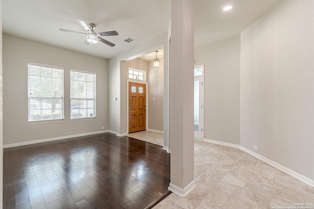 entrance foyer featuring ceiling fan