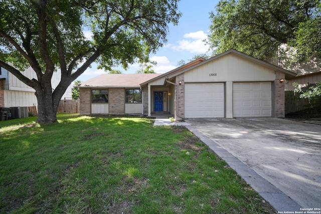 ranch-style house with a garage and a front yard