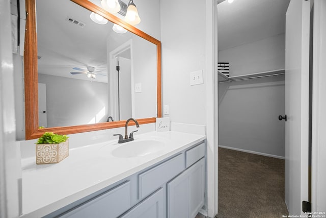 bathroom with ceiling fan and vanity