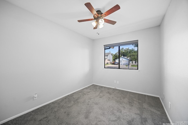 empty room featuring carpet flooring and ceiling fan