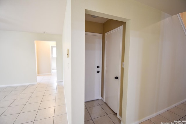 corridor with light tile patterned floors